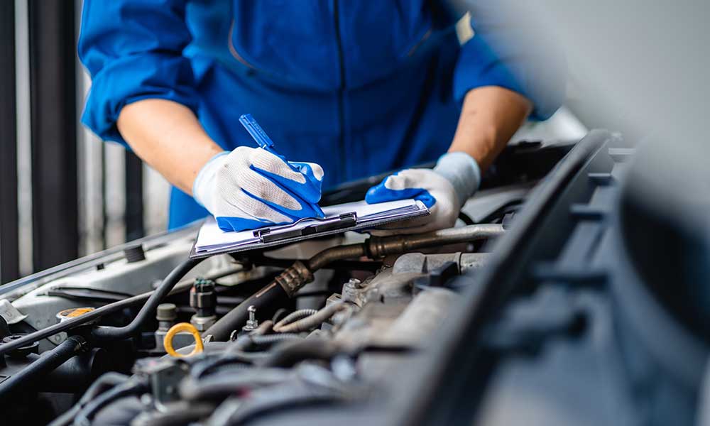 Automotive mechanic repairmen checking the system working engine