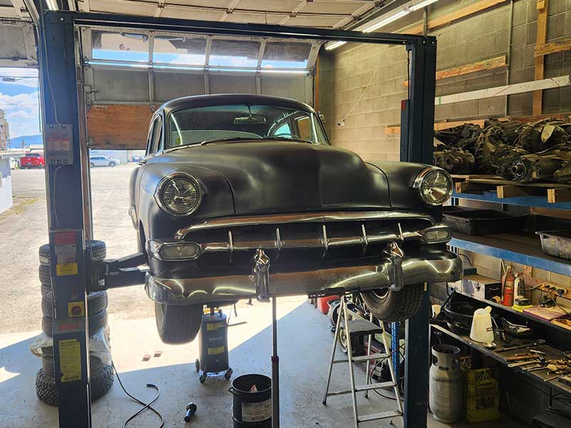 Discount Tires & Auto working on antique car on hoist Discount Tires & Auto working on antique car on hoist