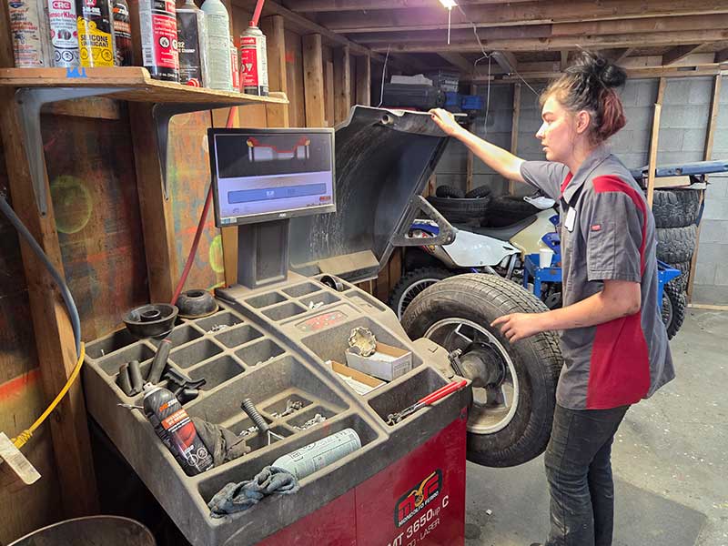 Discount Tires & Auto technician completing steering and tire wear diagnostics