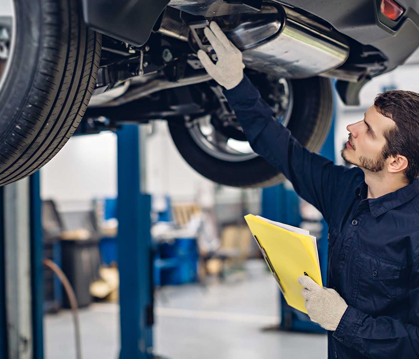Mechanic examining car after a repair