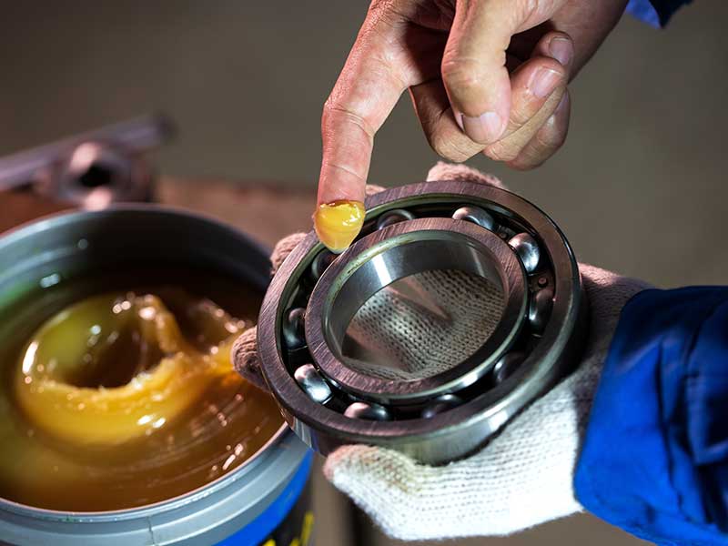 Discount Tires & Auto mechanic checking gasket