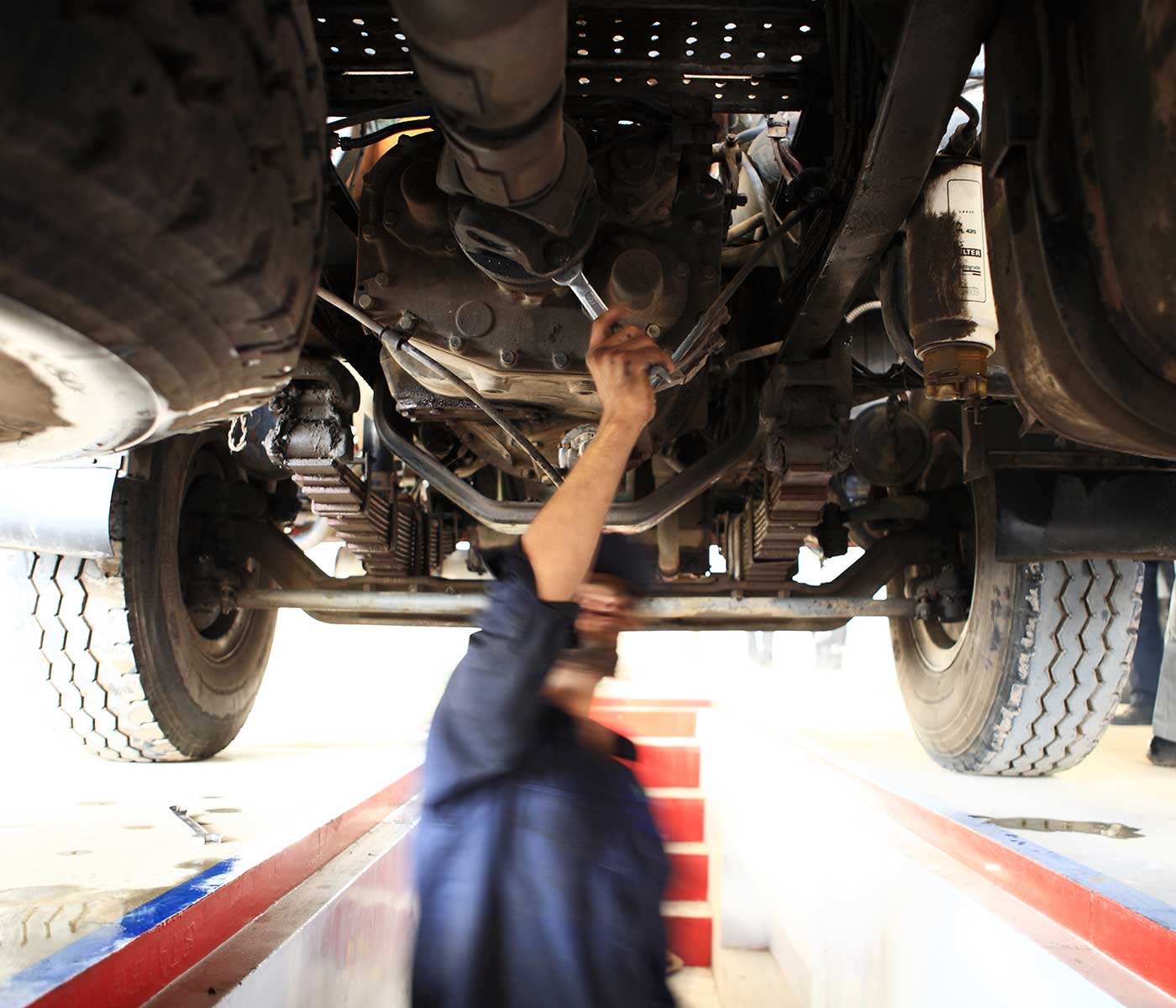 Motor Mechanic Fixing a Truck